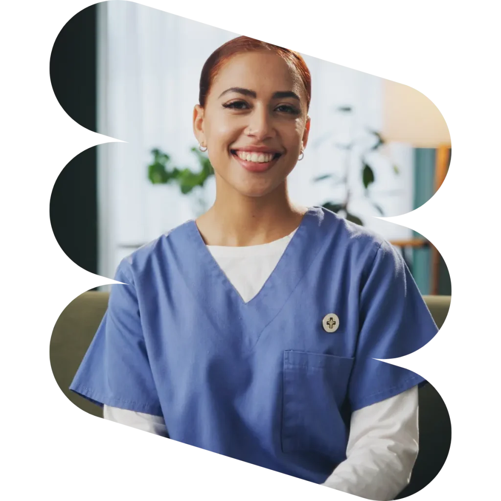 Happy nurse smiling at camera